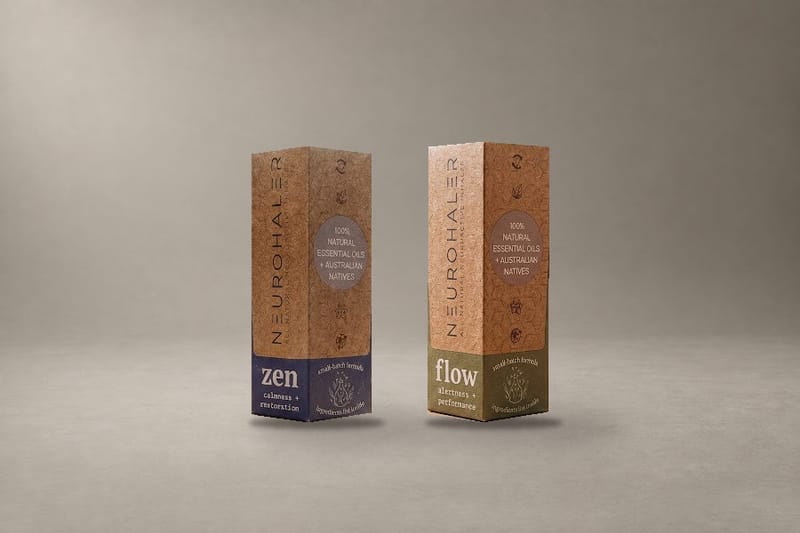 The original Neurohaler Zen and Flow boxes stand together against a warm grey studio background.